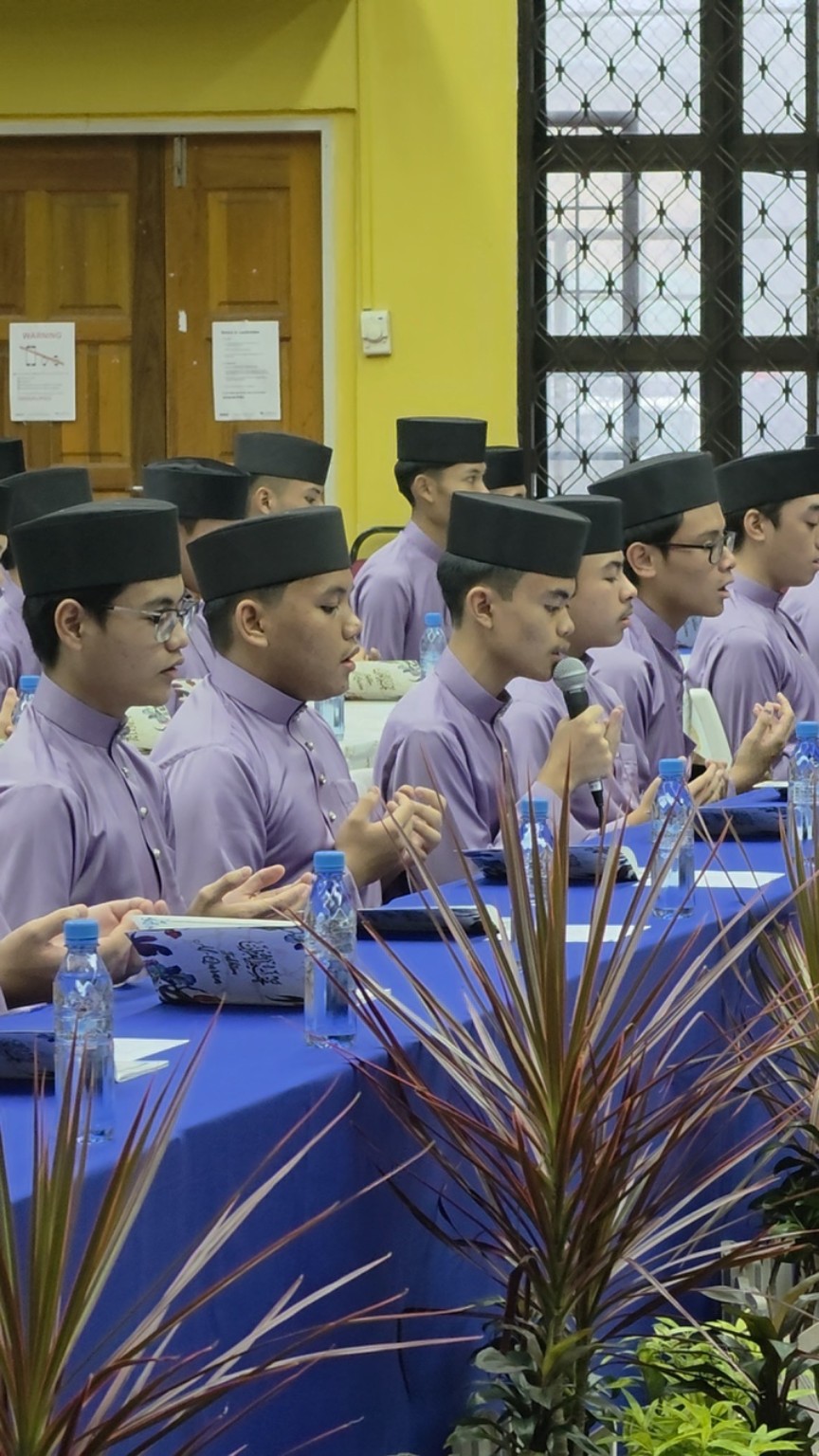 Student reciting during Majlis Khatam Al-Quran