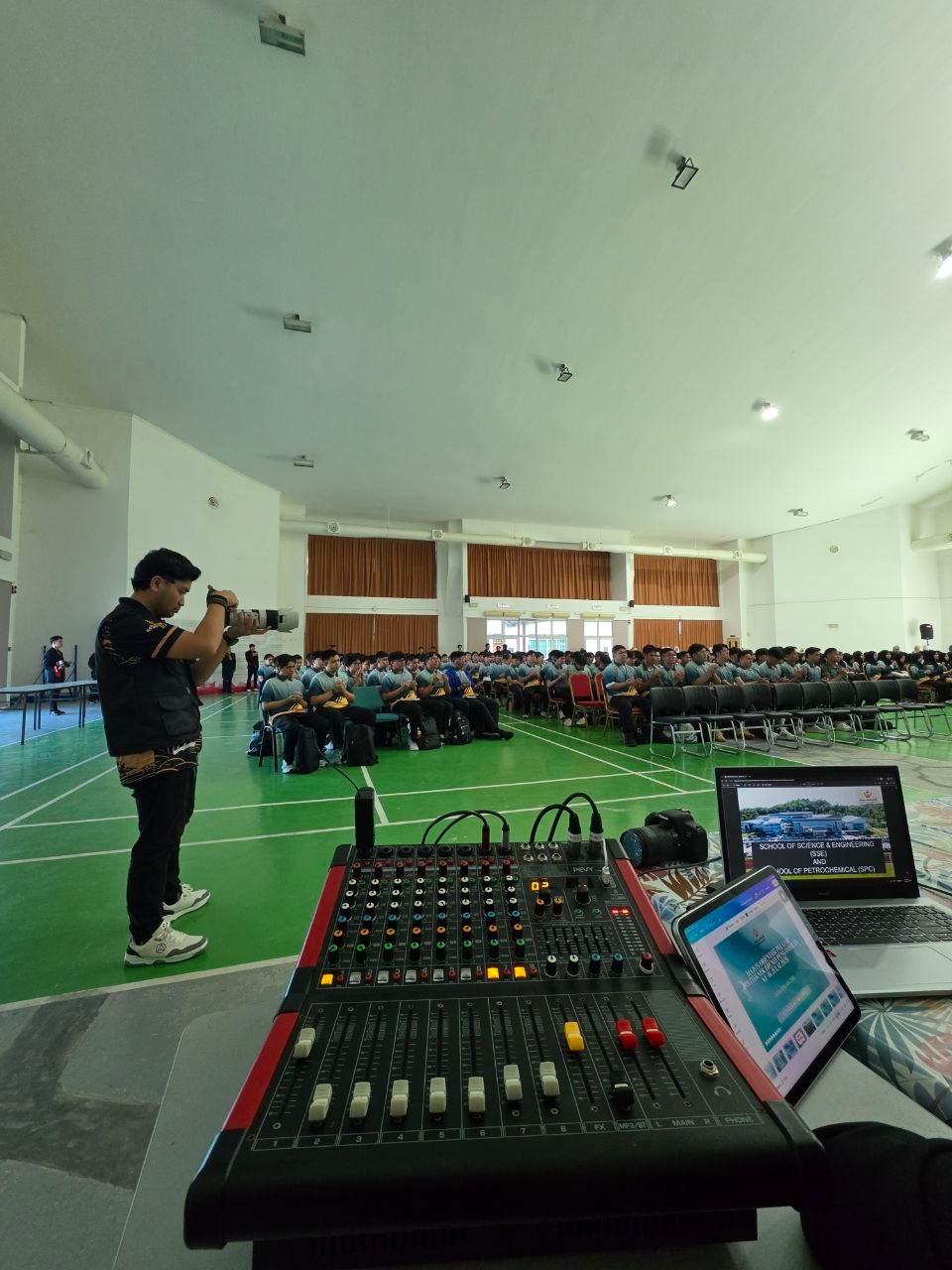 Sound desk and audience inside the Lumut Campus hall